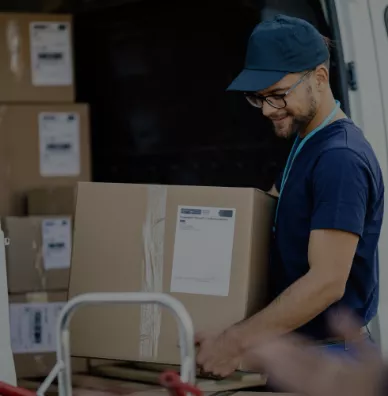 Mover putting a box in a truck